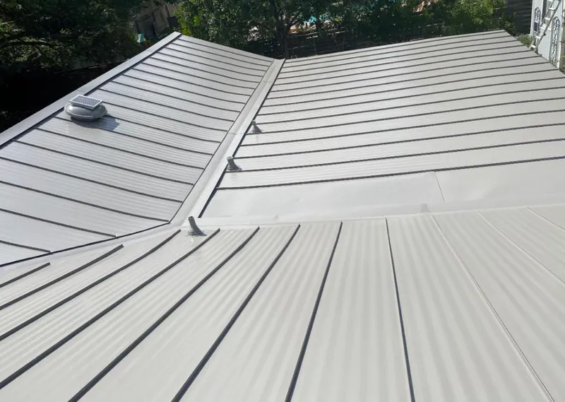 Solar attic fan installed on a metal roof for Roof Ventilation in Oceano